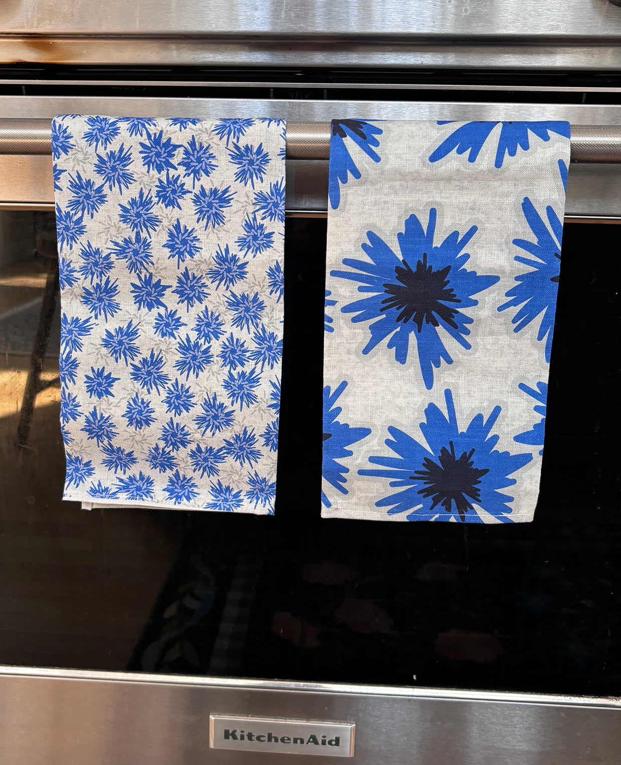 Cornflowers set of two 100% linen tea towels. One of each pattern: Mighty Blue and Rukki Fields