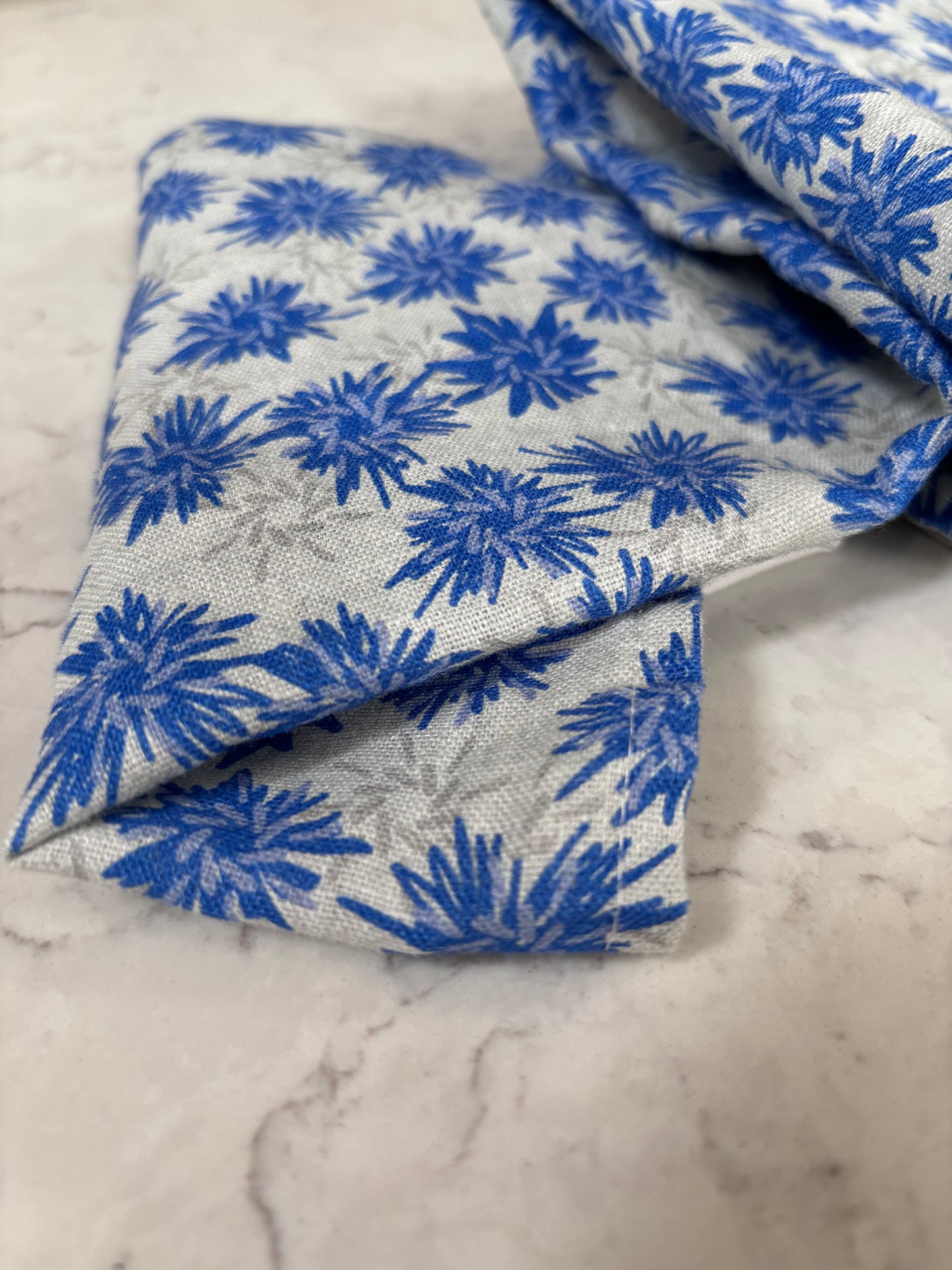 Rukki Fields of windswept cornflowers cover this 100% linen tea towel.