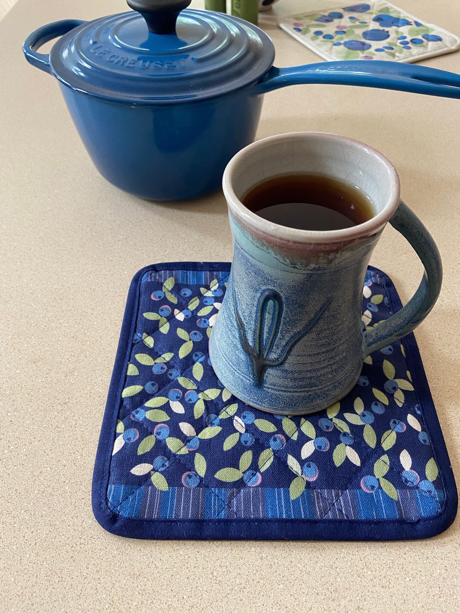 Brighten up any kitchen with a field of wild blueberries linen pot holder! Perfect hostess housewarming gift. A unique and useful gift