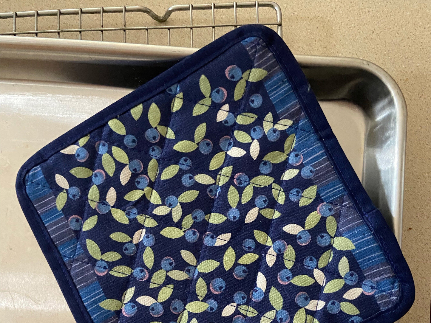 Brighten up any kitchen with a field of wild blueberries linen pot holder! Perfect hostess housewarming gift. A unique and useful gift