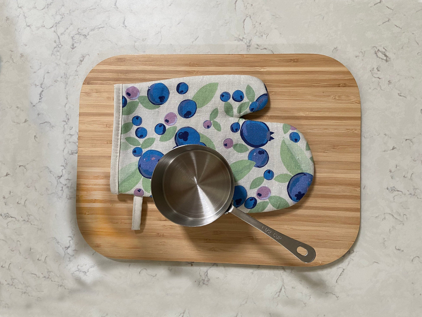 A Scandi-style big bold blueberry linen oven mitt will brighten up any kitchen! Perfect hostess housewarming gift. A unique and useful gift