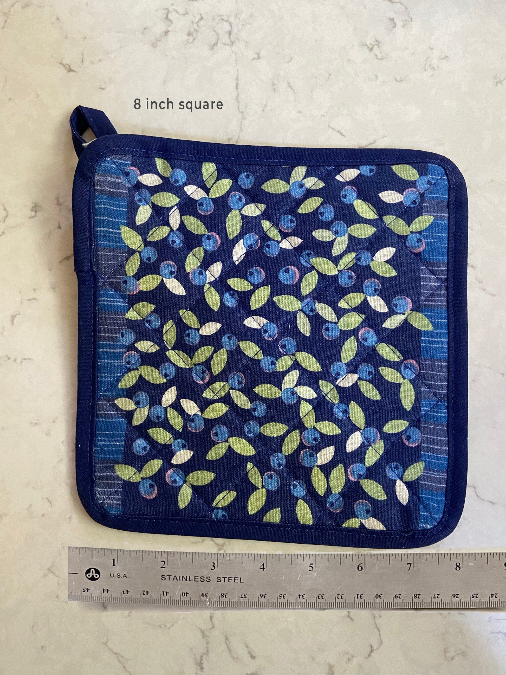 Brighten up any kitchen with a field of wild blueberries linen pot holder! Perfect hostess housewarming gift. A unique and useful gift