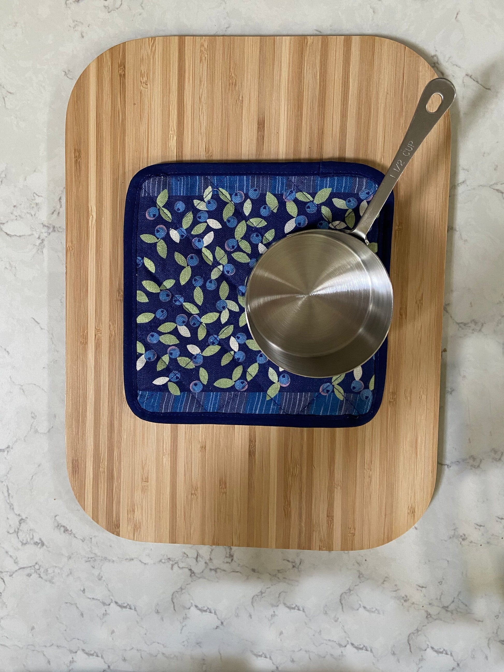 Brighten up any kitchen with a field of wild blueberries linen pot holder! Perfect hostess housewarming gift. A unique and useful gift